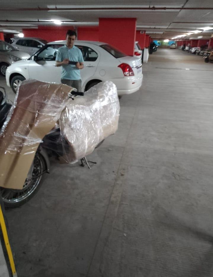 Motorcycle protected with cardboard and wrapping