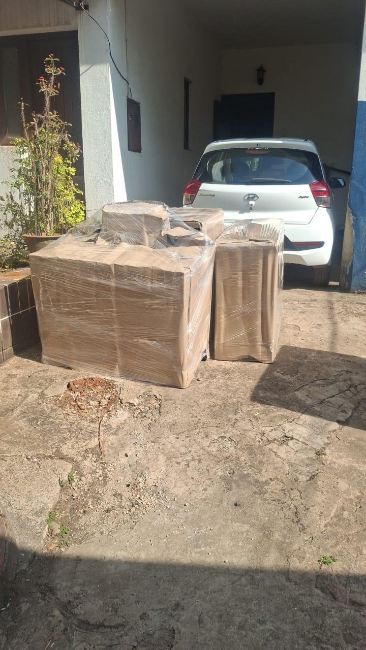 Packed armchairs outside a home