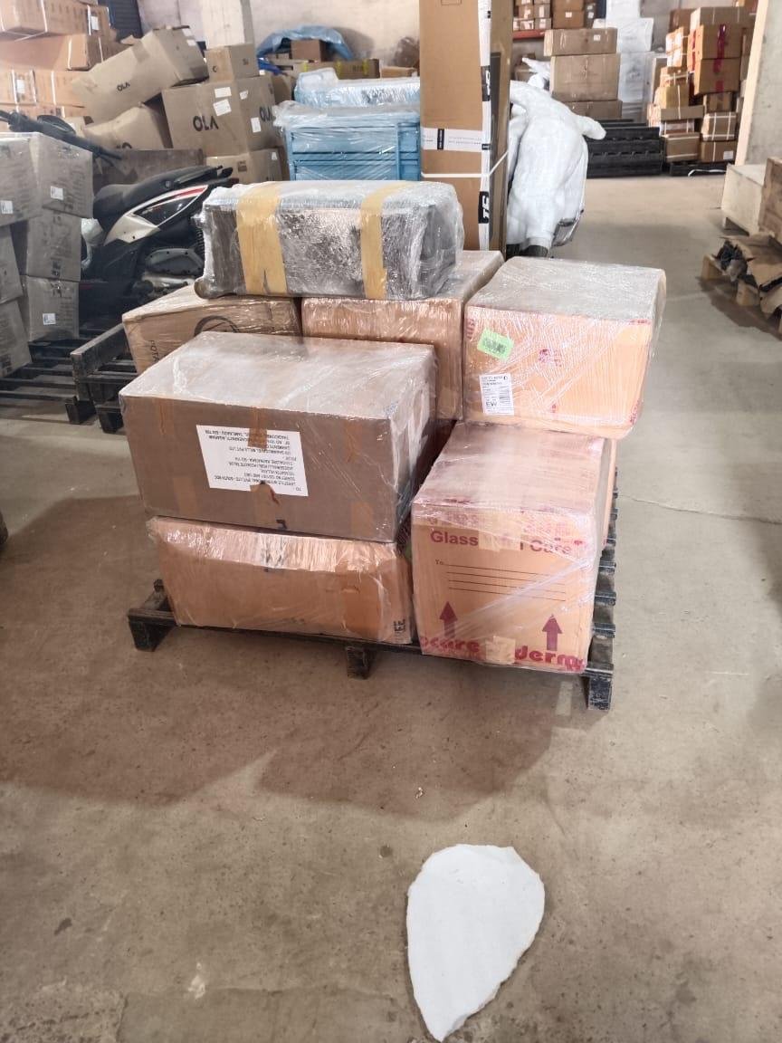 Packed cartons secured on a warehouse pallet