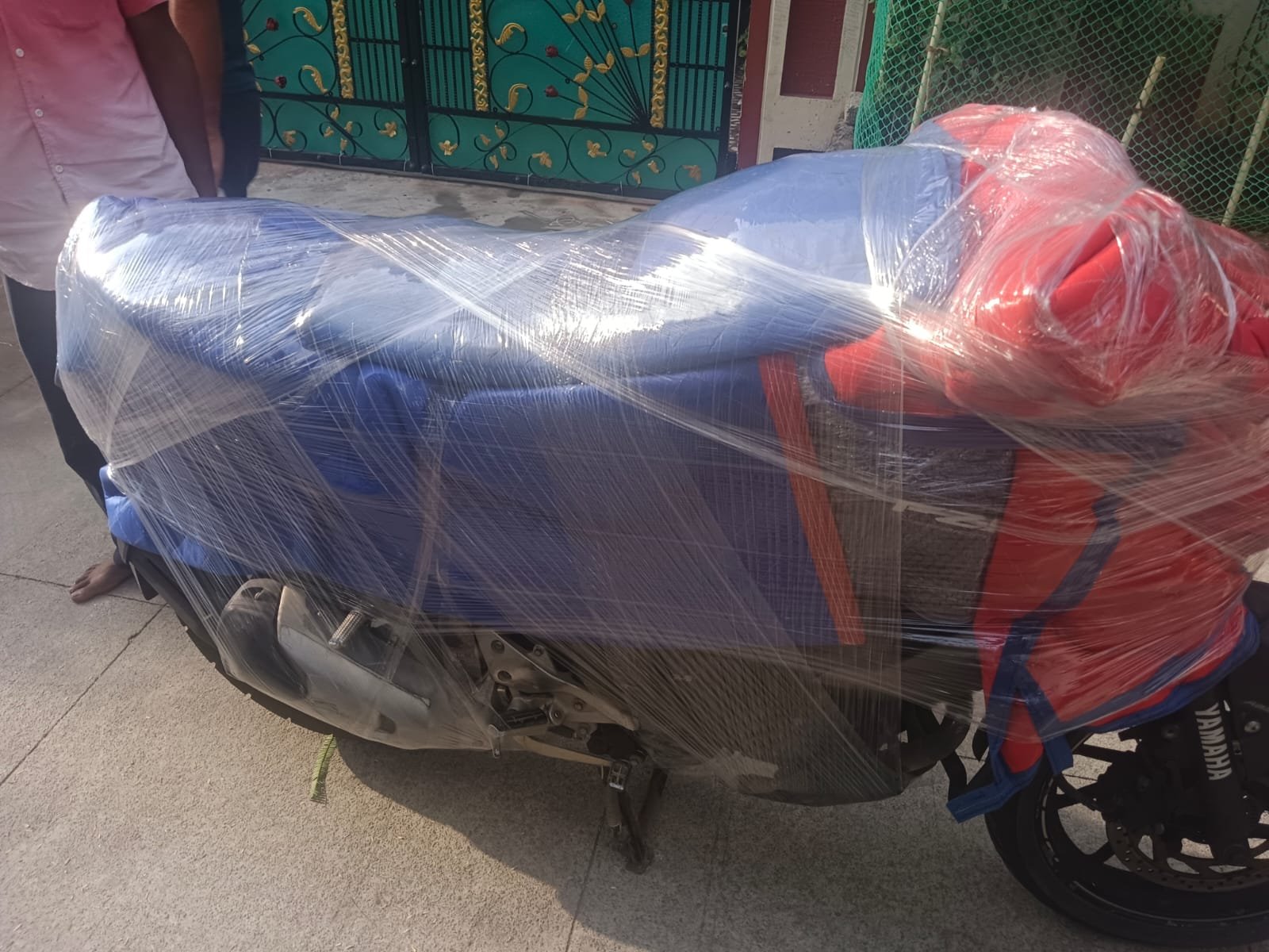 Motorcycle covered with protective blankets and wrapping